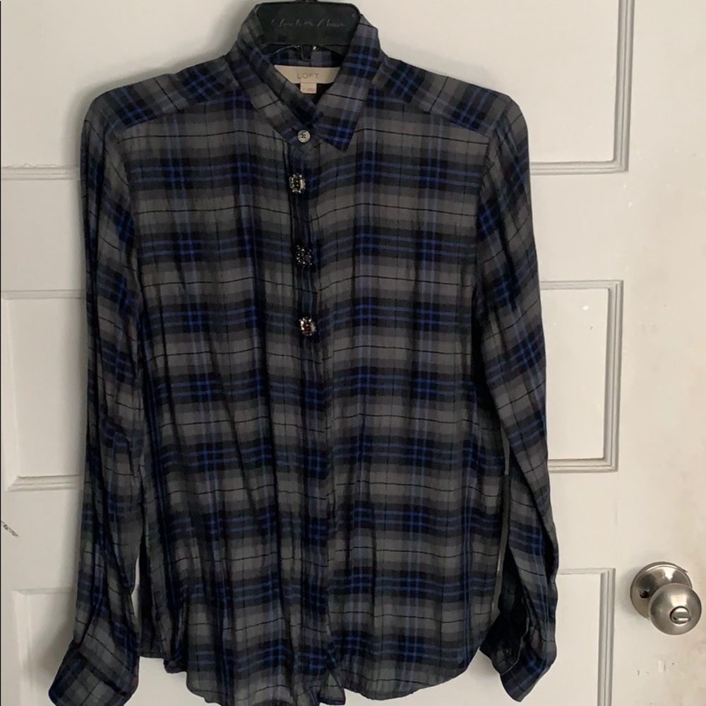 Plaid shirt with beaded button detail.